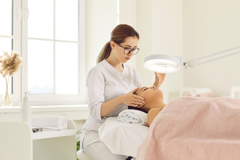 a skin therapist preparing their clients skin